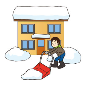 癒えの前を雪かきする人