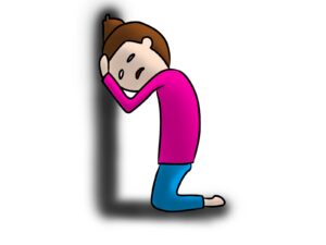 壁にもたれかかる人