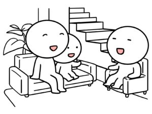 リビング階段のあるLDKで談笑する家族